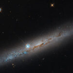 NASA Ungkap Citra Galaksi NGC 1827, Teleskop Hubble Tampilkan Jalur Debu Gelap
